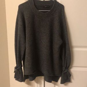 Zara high-low sweater with tie sleeves.